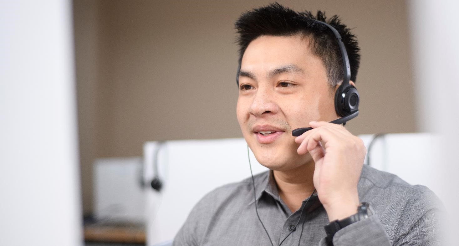 Man talking to a customer over headset