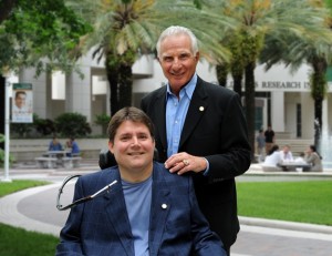 Father and son Nick and Marc Buoniconti pose in front of a research center for the Miami Project, striving to cure paralysis